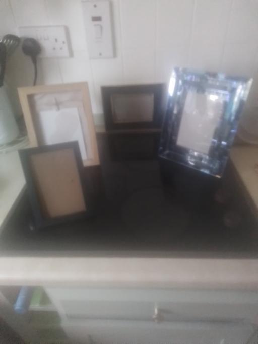  — FOUR DIFFERENT PICTURE FRAMES