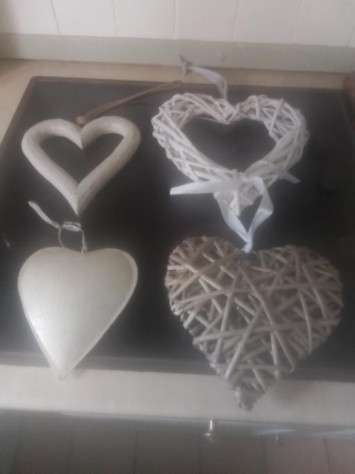  — FOUR HEART HANGERS