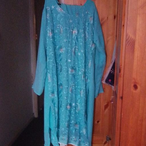  — blue colour Asian Indian dress .