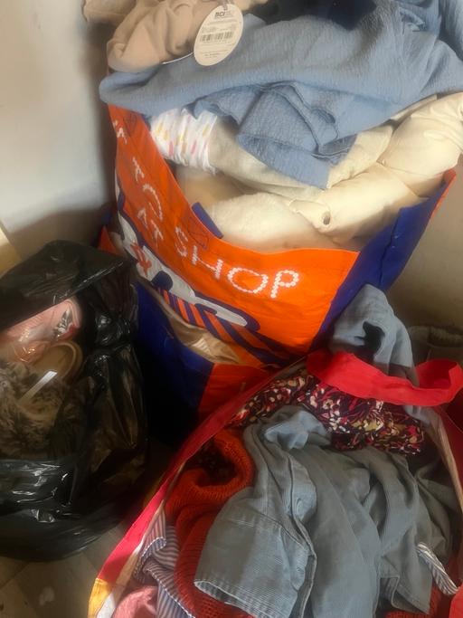  — Four large bags of clothes ladies and kids