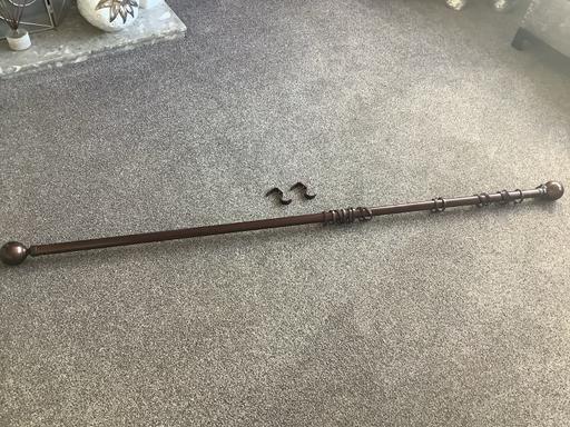  — Brown metal curtain pole