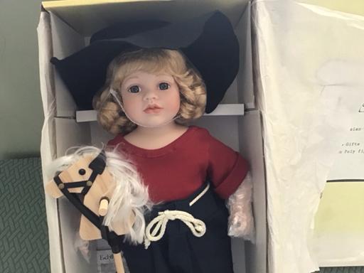  — Doll