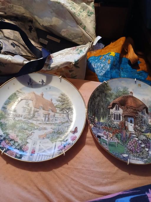  — 2 collecters hang up plates