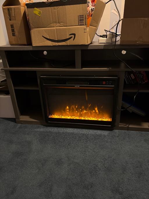  — Tv cabinet and electric fire