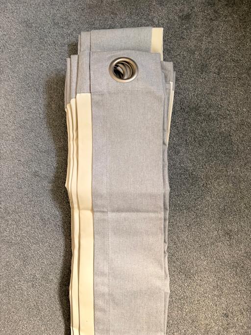  — Light grey eyelet pair of curtains