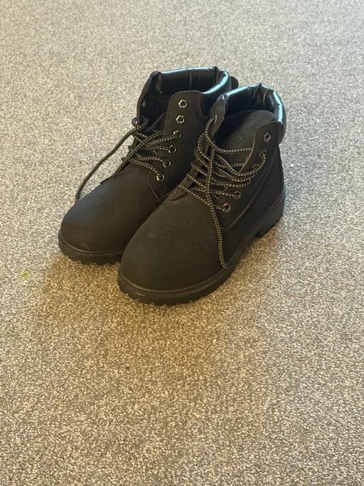  — Black boots