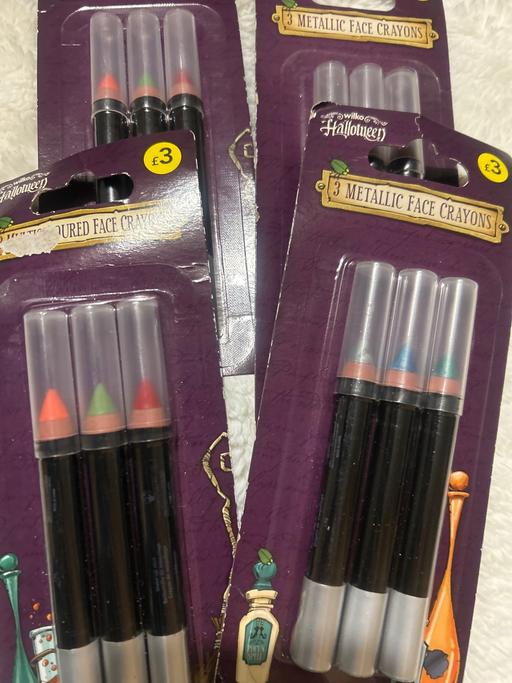  — Halloween metallic face crayons. 2 designs.