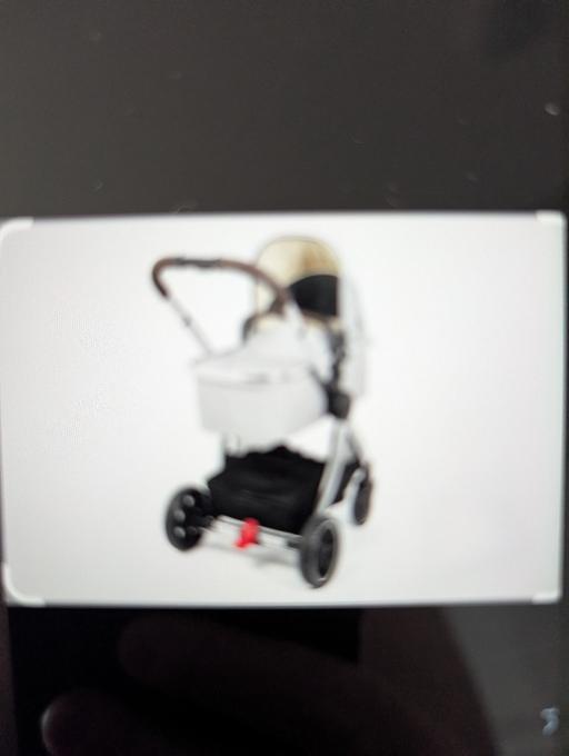  — Mothercare travel system