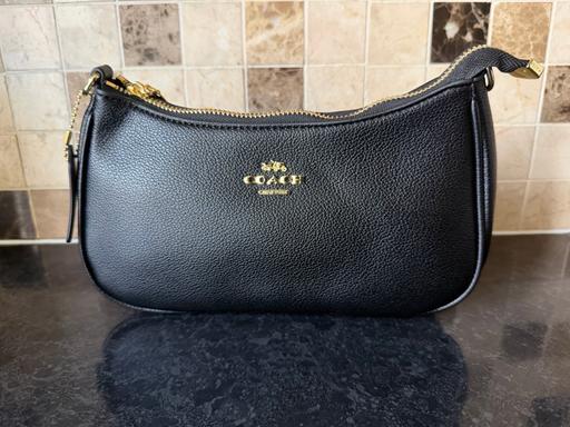  — Coach handbag