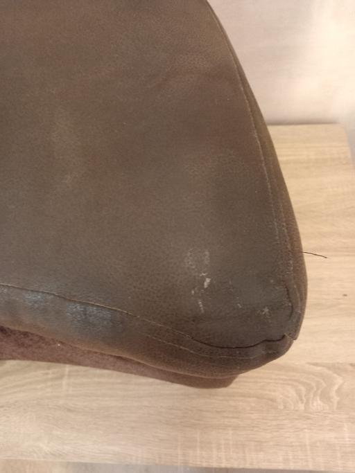  — Crescent shaped foot pouf