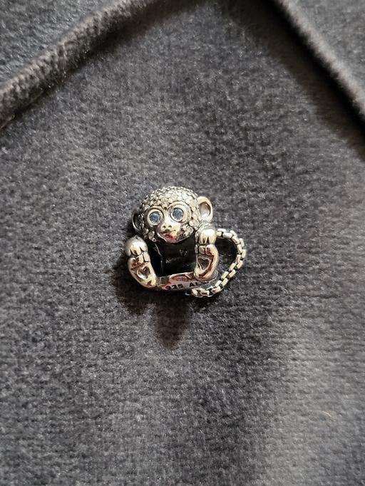  — Pandora. Monkey silver charm with clear and t