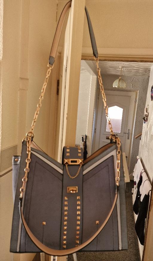  — Handbags