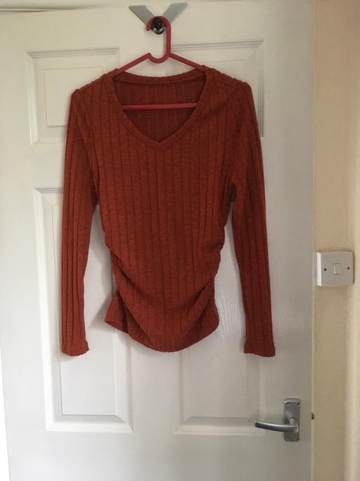  — Jumper size Small.(Rusty Colour)