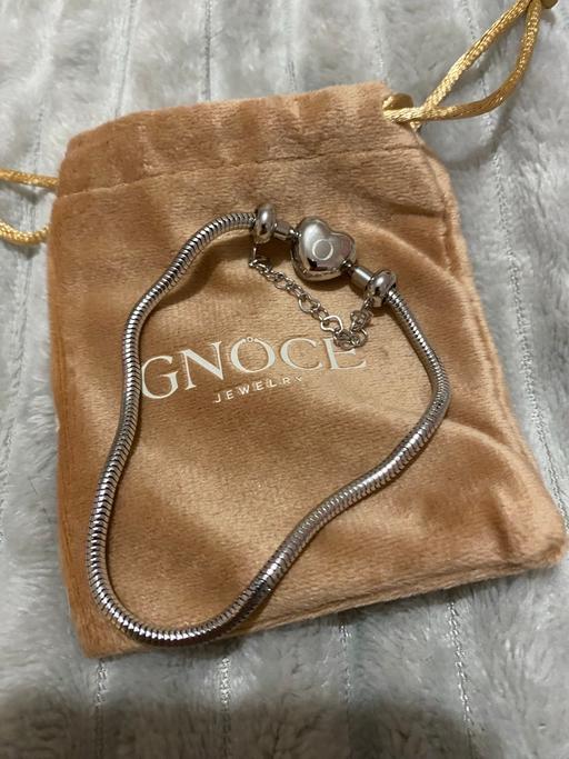  — Gnoce charm bracelet