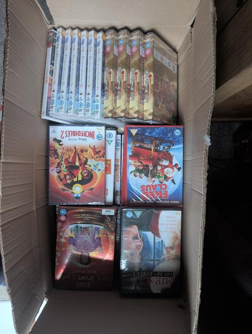  — box of brand new sealed dvds, roughly 130.