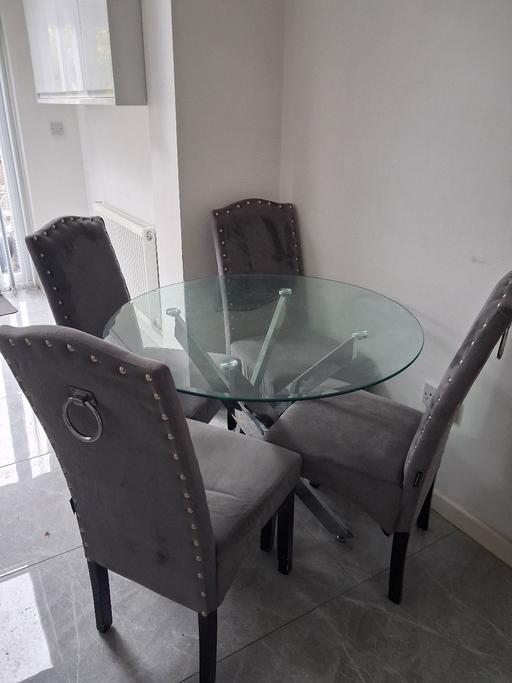 — glass dining table and 4 chairs