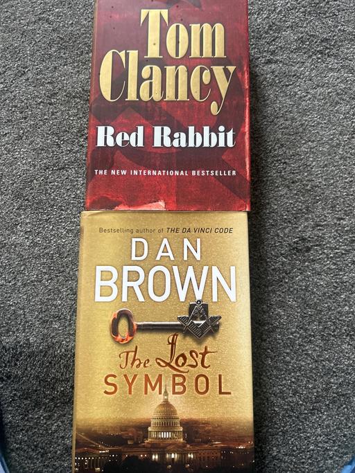  — Tom Clancy/Dan Brown books. Used