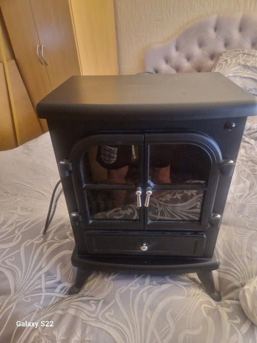  — Black wooden coal fire