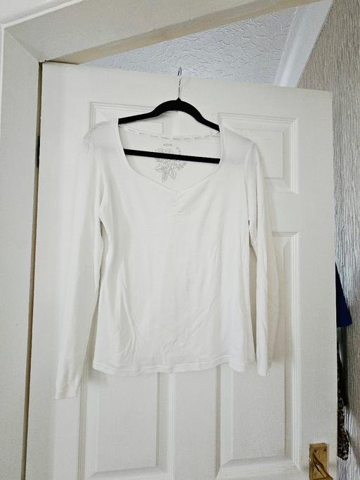  — White long sleeved top, size 12..NEW