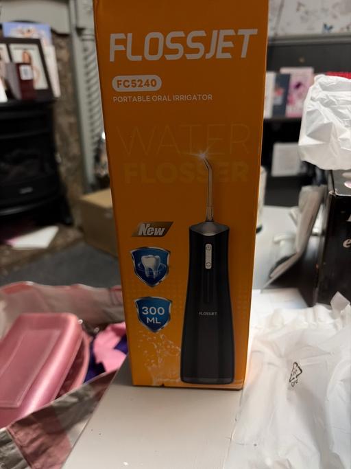  — Portable flosser