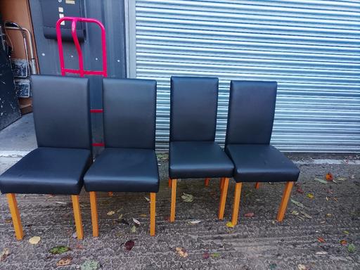  — 4 brown faux leather dining chairs