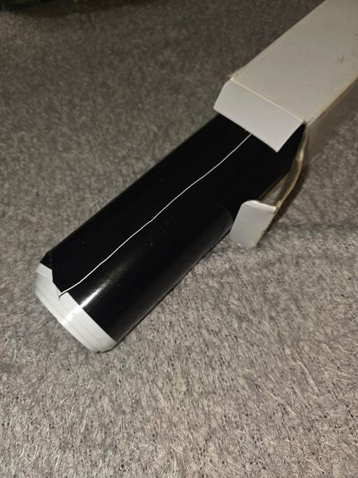  — Roll of black Wrap