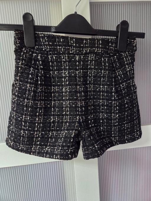  — Age 7 NEXT black & gold shorts